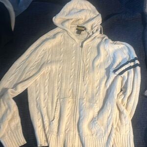 Rarely worn zip up knit hoodie from Rugby Polo with blue varsity stripes on left